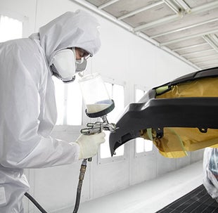 Collision Center Technician Painting a Vehicle | Titus-Will Toyota in Tacoma WA