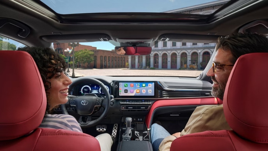 A couple sitting inside the 2026 Toyota Camry.