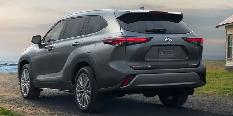 Rear view of a Toyota Highlander Hybrid parked near beach